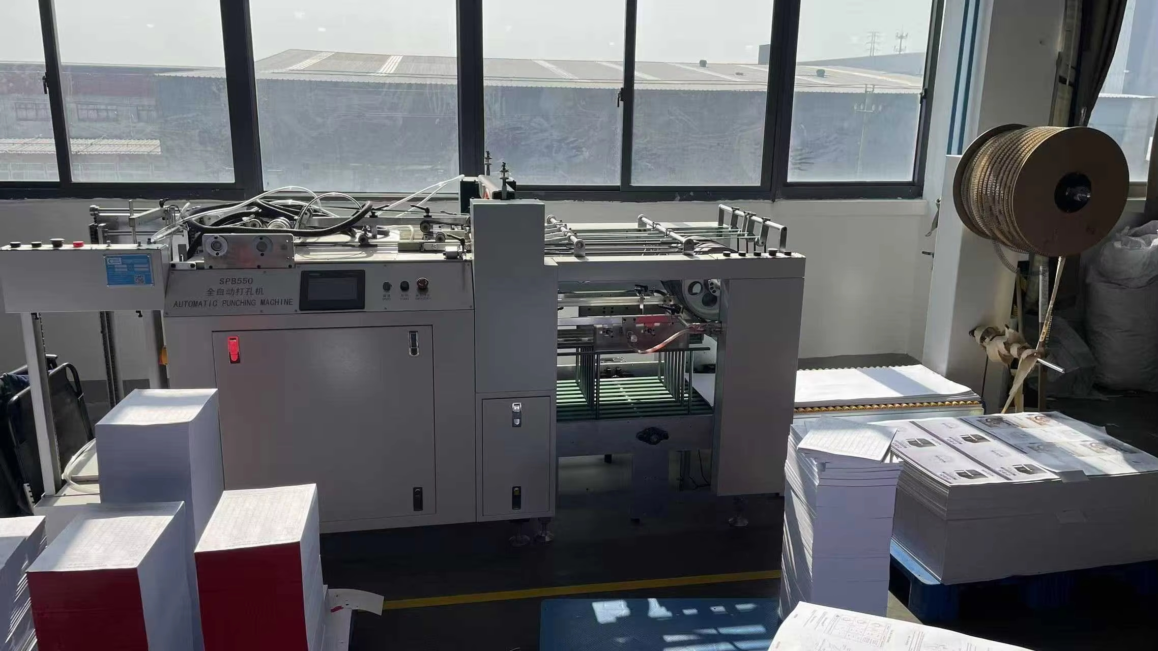 Automatic punching machine operating in a production workshop